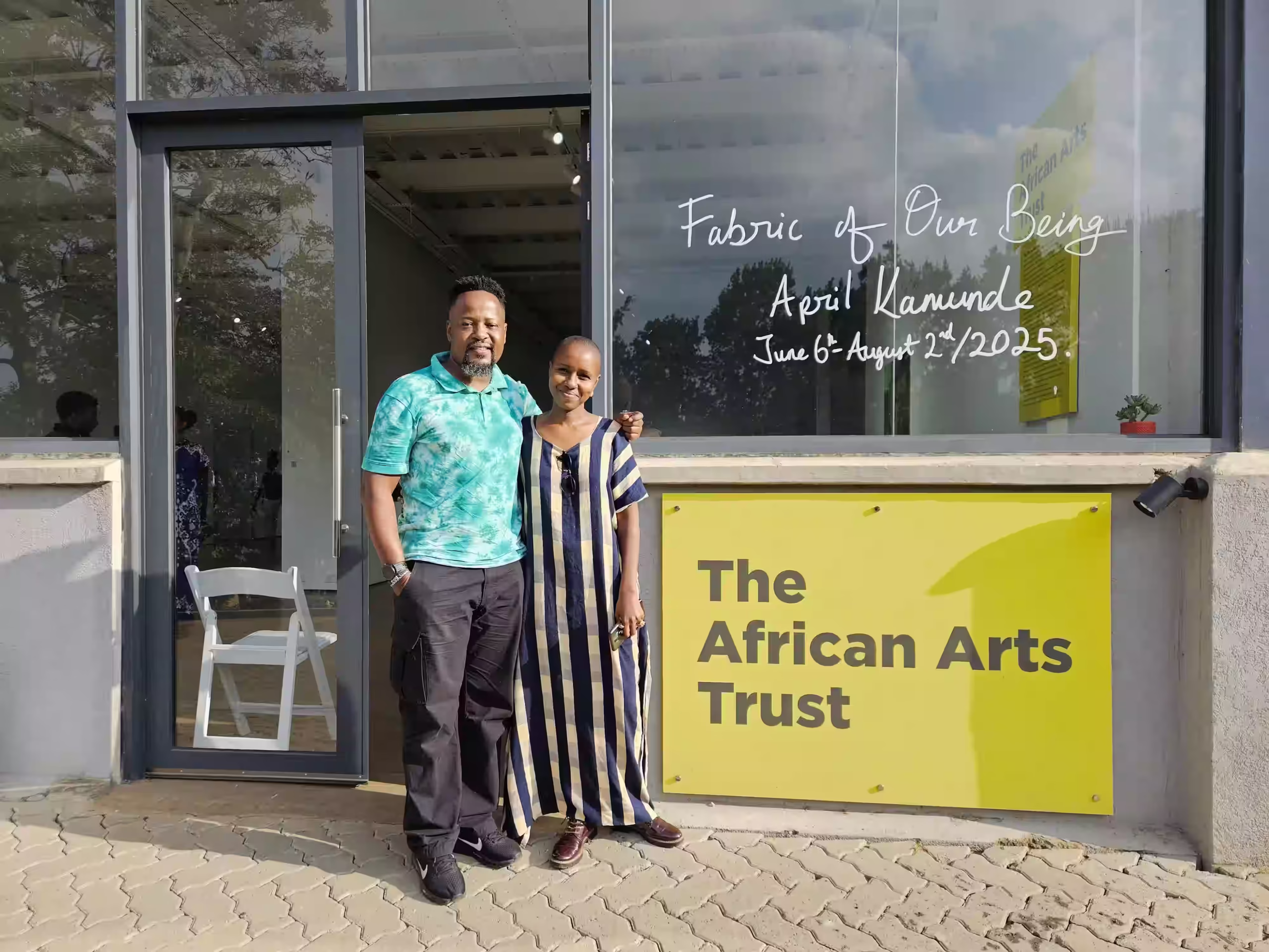 April Kamunde with Almasi Art Agency Director Reuben Onsinyo at exhibition titled "Fabric of Our Being" held at The African Arts Trust (TAAT) organized by Afriart Gallery
