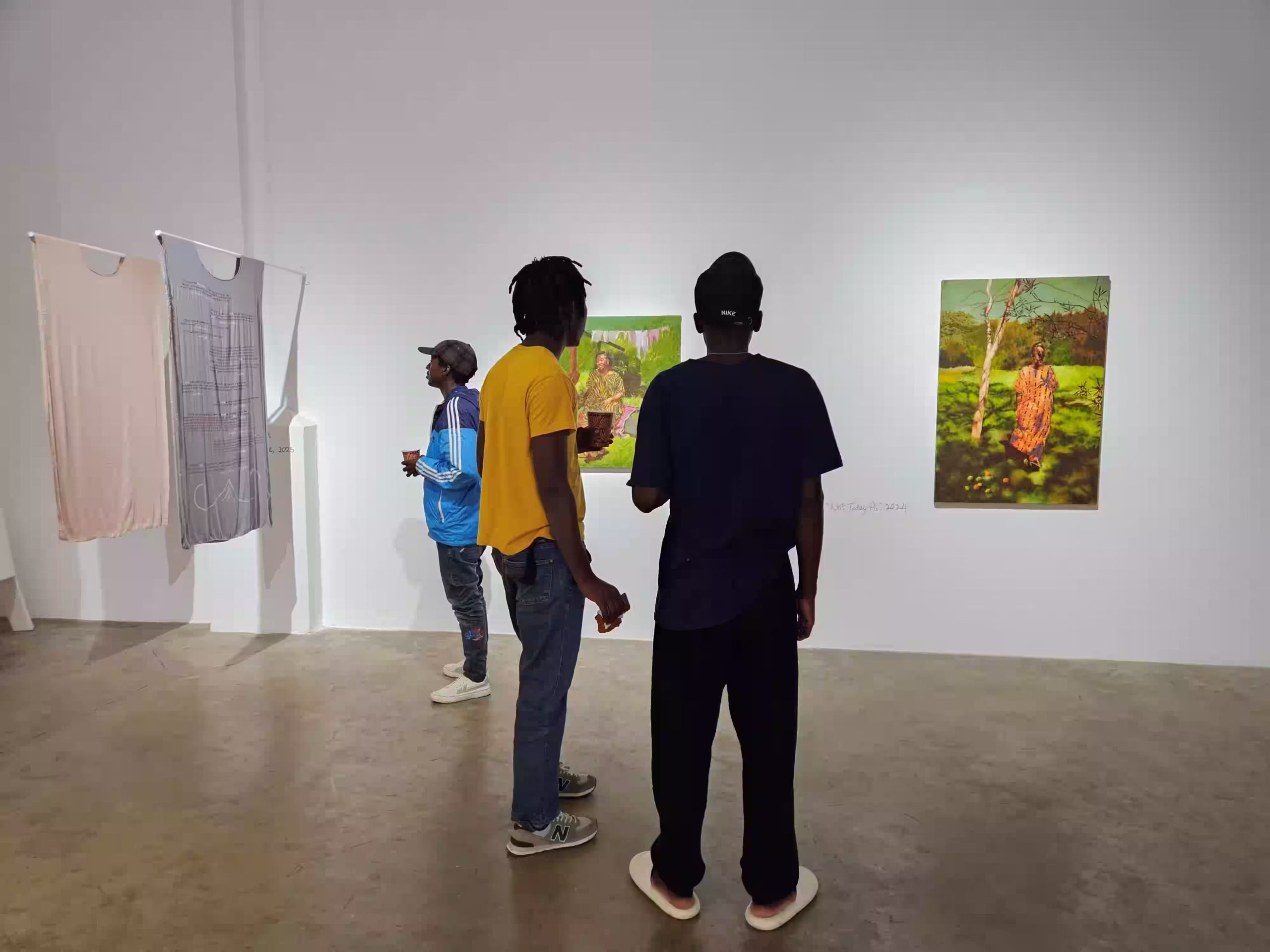 Art enthusiasts of all ages observe Fabric of our Being art installation by April Kamunde at the The African Arts Trust