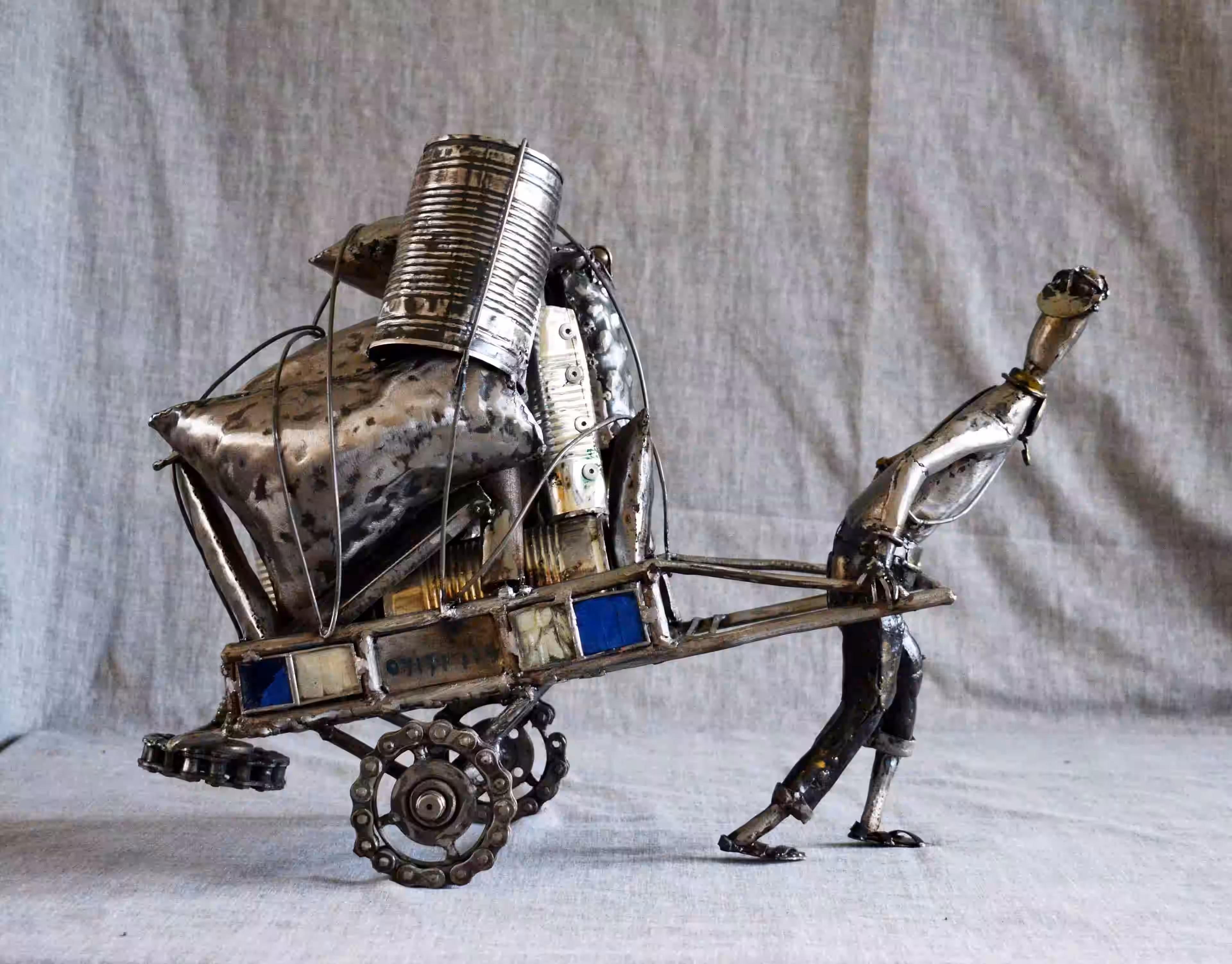 Metal sculpture titled Natafuta Salary by Kenyan Atieno Sachy